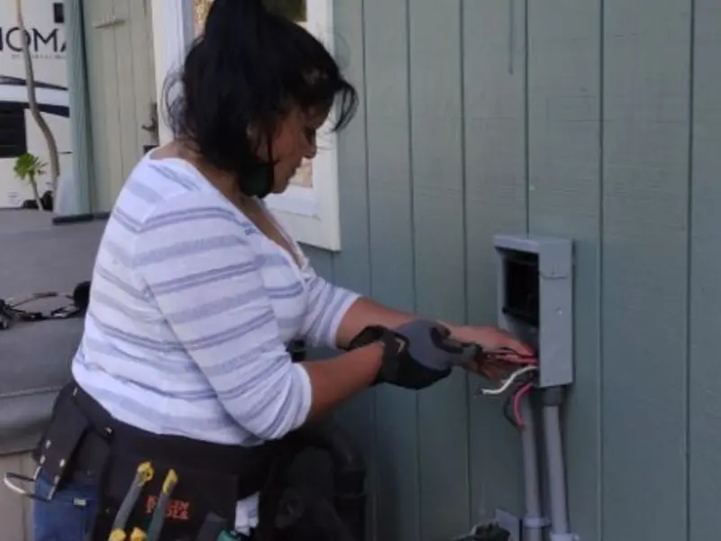 Licensed electrician wiring an exterior subpanel in Round Lake